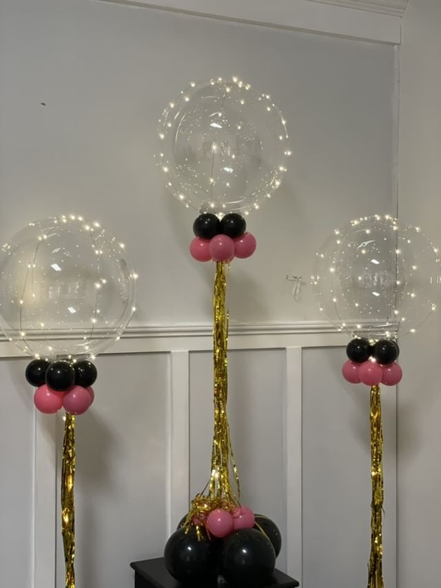 18 inch white Crystal Clearz LED balloon with helium and ribbon as centerpieces