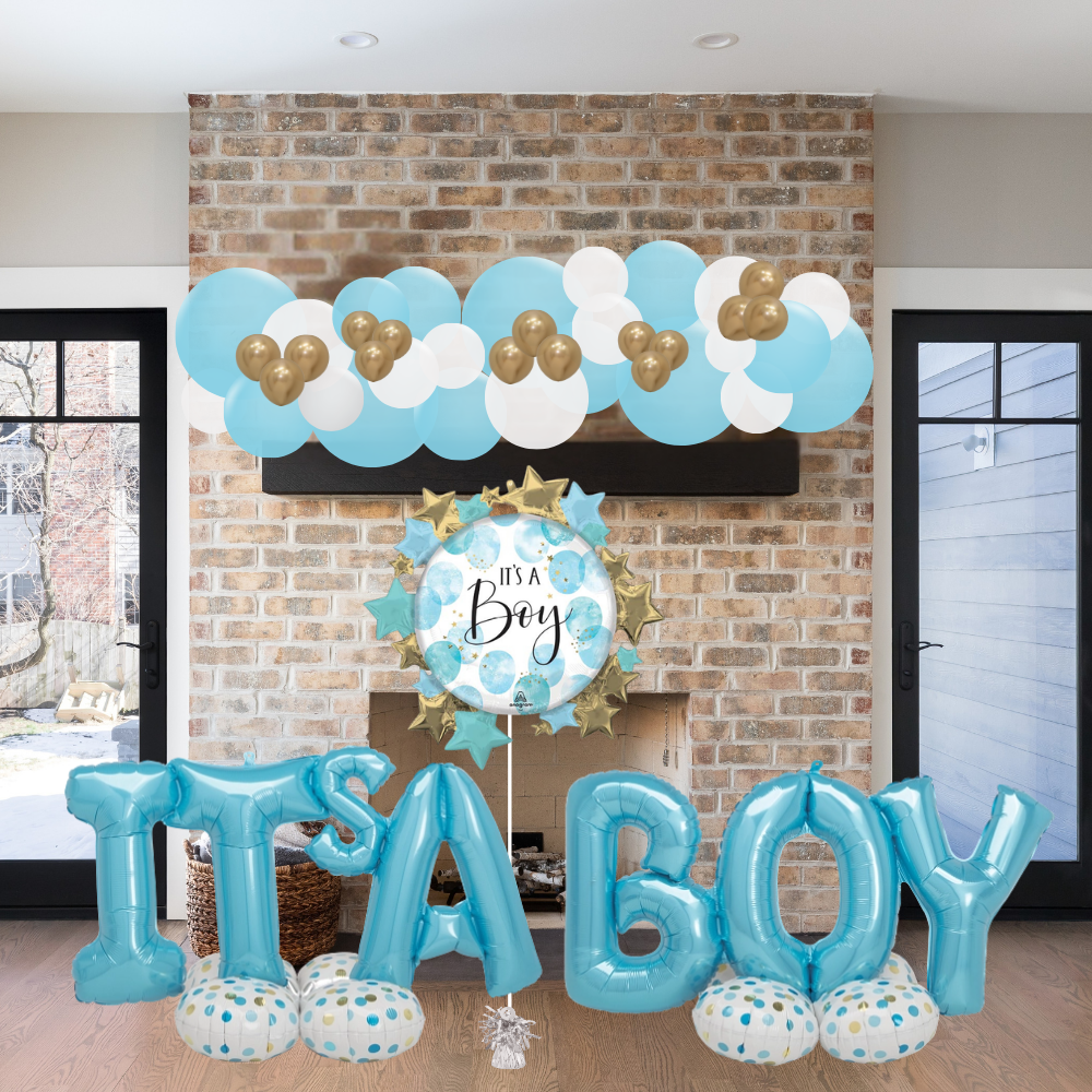 Decorative balloons with 'It's a Boy' text against a brick wall.