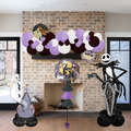 Halloween-themed decorations including balloons and skeleton figure in front of a fireplace.