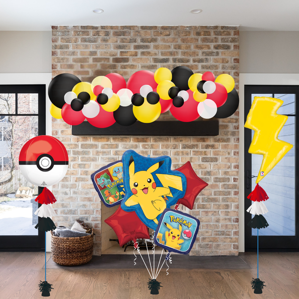 Colorful Pikachu-themed balloons against a brick wall.