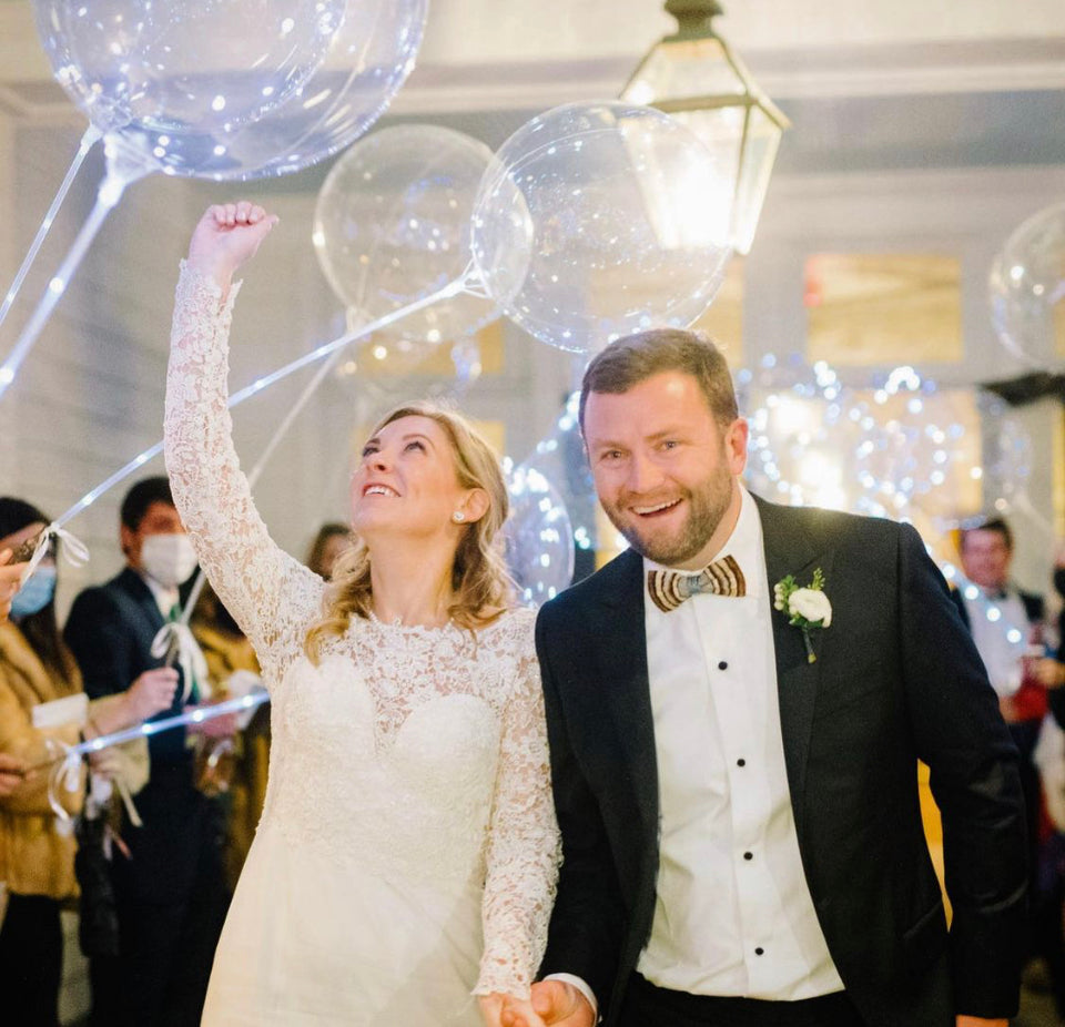 bride and groom with 18 inch white Crystal Clearz LED balloon with helium and ribbon